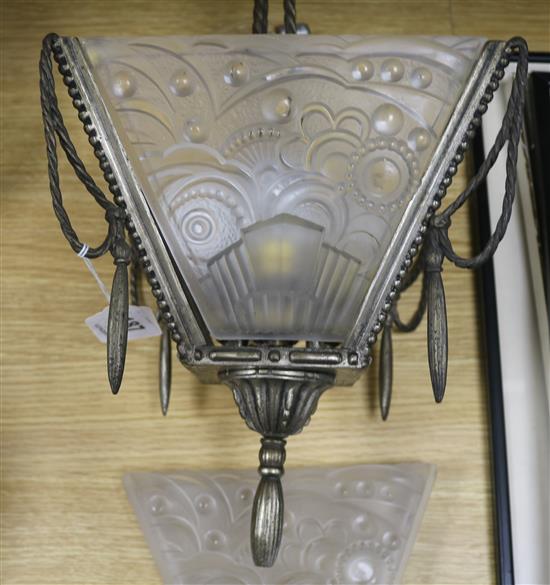 A silvered bronze ceiling light, with moulded shades